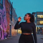 Group enjoying cannabis flower on Atlanta patio at dusk