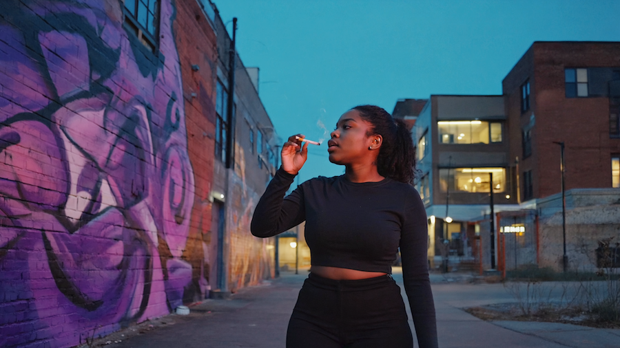 Group enjoying cannabis flower on Atlanta patio at dusk